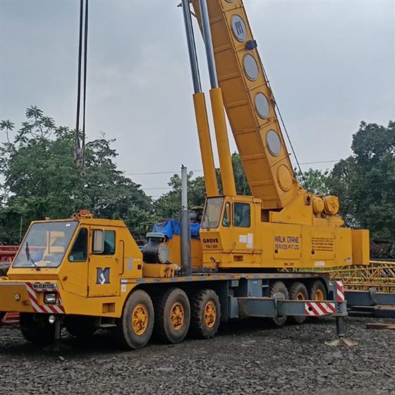 Grove hydraulic telescopic boom truck crane parked at a yard